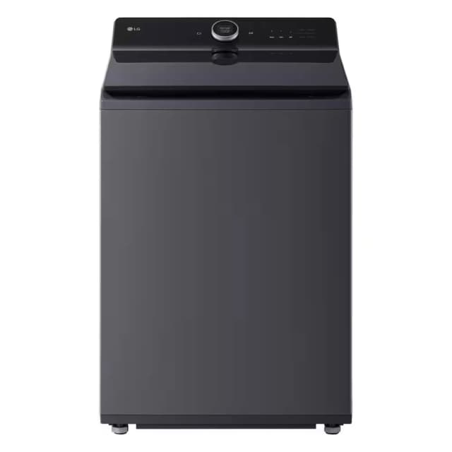 A top-loading washing machine in a laundry room