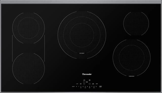 Technician inspecting an electric cooktop burner
